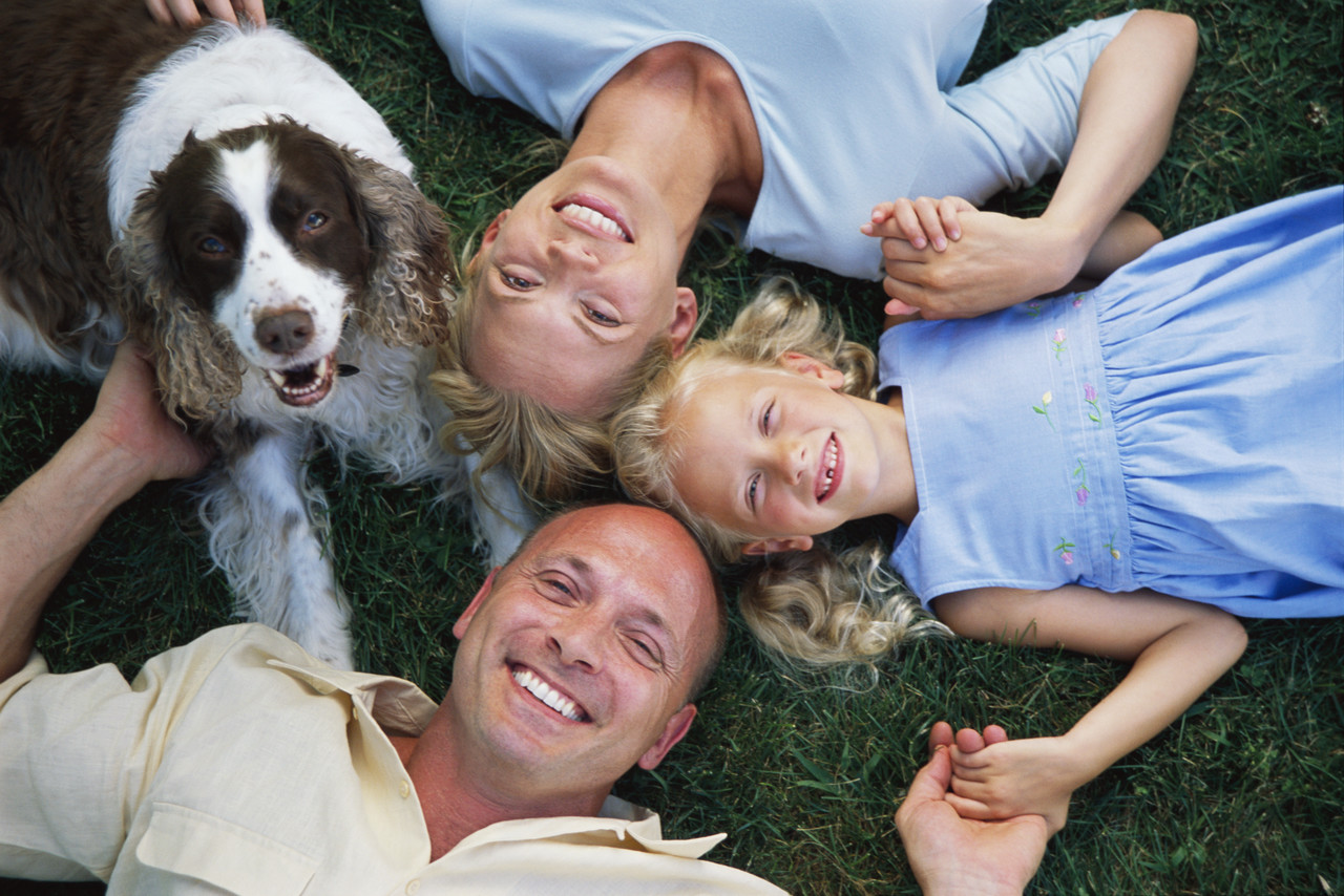 A family and their happy dog
